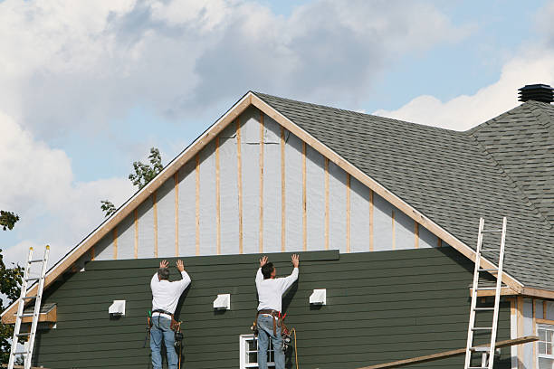 Professional Vinyl Siding technician working in Malverne, NY